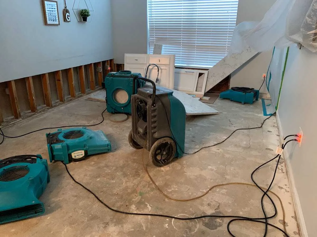 Dehumidifier in flood-cut room for Water Damage Restoration in Neosho